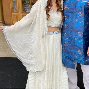 Custom Lehenga in Ivory with pearl and embellish details. Fits like an XS/S